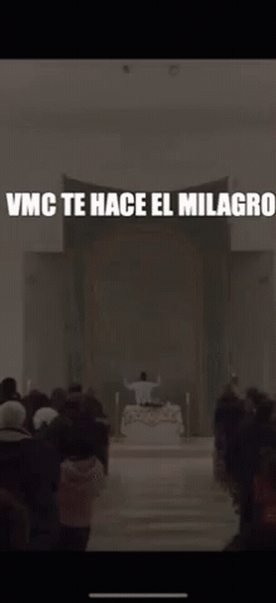 A Blurred Image Of A Church With The Words Vmc Te Hace El Milagros GIF