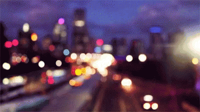 A Blurred Image Of A City At Night GIF