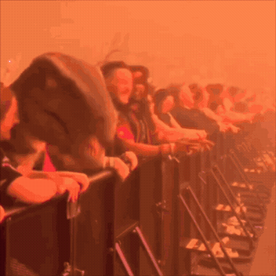 A Blurred Image Of A Crowd Of People Watching A Concert GIF