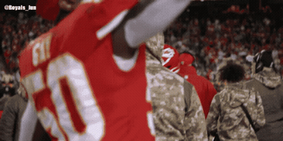 A Blurred Image Of A Football Player With The Number 50 On His Jersey GIF
