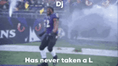 A Blurred Image Of A Football Player With The Words " Dj Has Never Taken A L " GIF