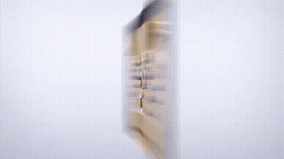 A Blurred Image Of A Group Of People In A Lecture Hall Is Displayed On A Computer Monitor GIF