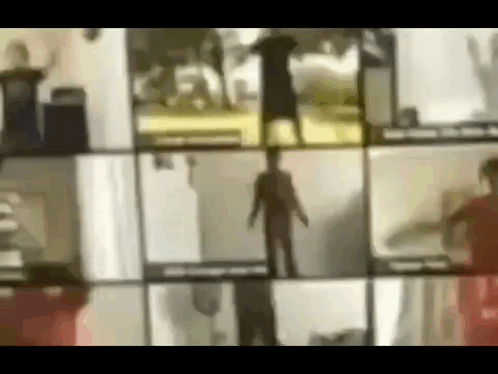 A Blurred Image Of A Group Of People Standing In Front Of A Window . GIF