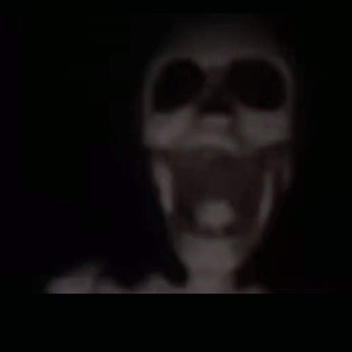 A Blurred Image Of A Lamp Hanging From The Ceiling . GIF