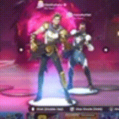 A Blurred Image Of A Man And Woman Standing On A Platform GIF