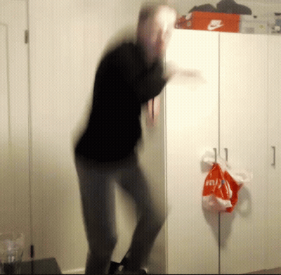 A Blurred Image Of A Man Dancing In Front Of A Nike Box GIF