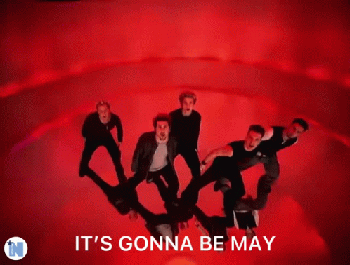 A Blurred Image Of A Man Dancing With The Words It 'S Gonna Be May GIF