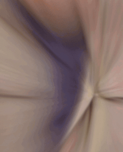 A Blurred Image Of A Man In A Striped Jacket GIF