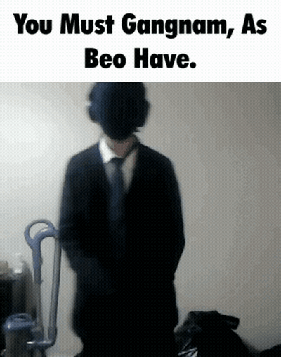 A Blurred Image Of A Man In A Suit And Tie With The Words You Must Gangnam As Beo Have GIF
