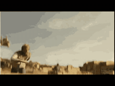 A Blurred Image Of A Man Kneeling In A Field With A Sign That Says ' Ranch ' On It GIF