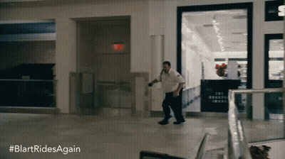 A Blurred Image Of A Man Running In A Mall With The Hashtag #Blartridesagain GIF