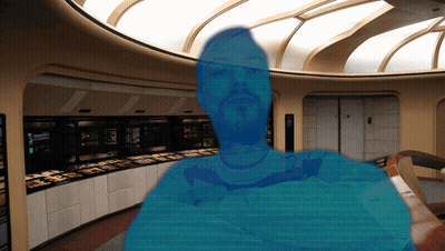 A Blurred Image Of A Man With A Beard In A Room With A Sign That Says ' A ' On It GIF