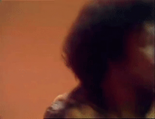 A Blurred Image Of A Man With A Mustache GIF