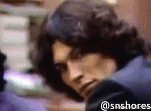 A Blurred Image Of A Man With The Hashtag @Snshores GIF