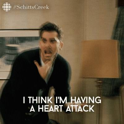 A Blurred Image Of A Man With The Words I Think I 'M Having A Heart Attack Below Him GIF