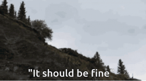 A Blurred Image Of A Mountain With The Words " It Should Be Fine " On The Bottom GIF