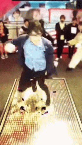 A Blurred Image Of A Person Dancing On A Stage GIF