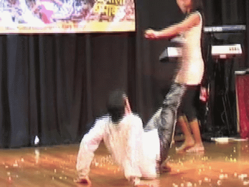 A Blurred Image Of A Person Dancing With A Keyboard In The Background That Says Korg On It GIF