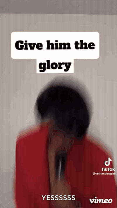 A Blurred Image Of A Person Holding A Microphone With The Words `` Give Him The Glory '' Written Above Them . GIF
