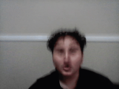 A Blurred Image Of A Person In A Closet With A White Railing GIF