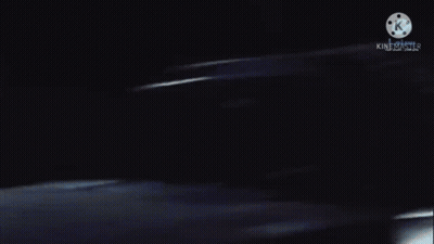 A Blurred Image Of A Person In A Dark Room With A K On The Bottom GIF