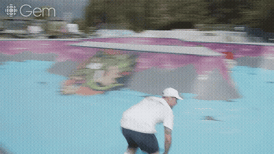 A Blurred Image Of A Person Riding A Skateboard With A Gem Logo Behind Them GIF