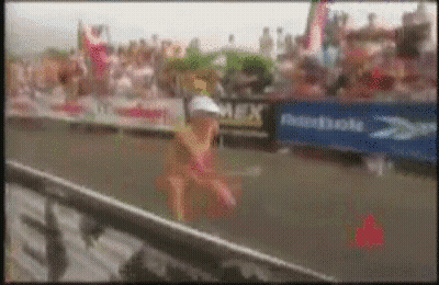 A Blurred Image Of A Person Running In Front Of A Domino 'S Banner GIF