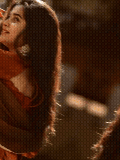 A Blurred Image Of A Person 'S Face Against A Grey Background GIF