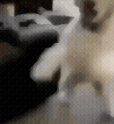 A Blurred Image Of A Person 'S Face With A Black Background GIF