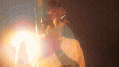 A Blurred Image Of A Person 'S Face With A Light Behind Them GIF