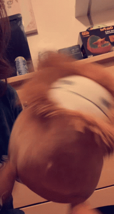 A Blurred Image Of A Person 'S Head With A Box In The Background That Says ' Xbox ' On It GIF