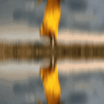 A Blurred Image Of A Person 'S Reflection In The Water GIF