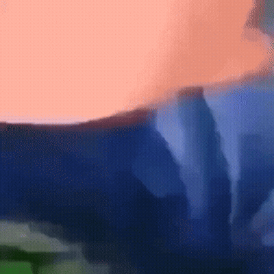 A Blurred Image Of A Person 'S Torso With A Blue Background GIF