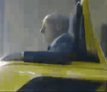 A Blurred Image Of A Person Sitting In A Yellow Chair GIF