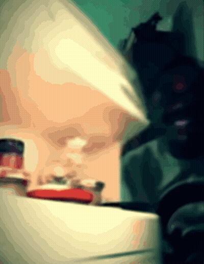 A Blurred Image Of A Person Standing In Front Of A Counter GIF