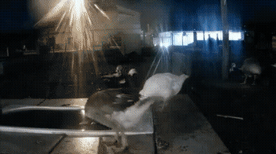 A Blurred Image Of A Person Standing In Front Of A House GIF