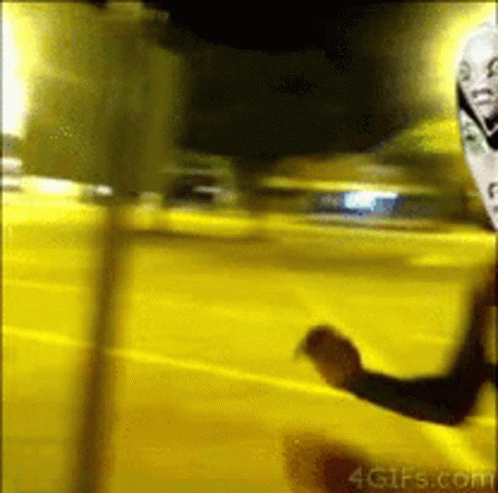 A Blurred Image Of A Person Standing In Front Of A Yellow Wall That Says 4Gifs.com On It GIF