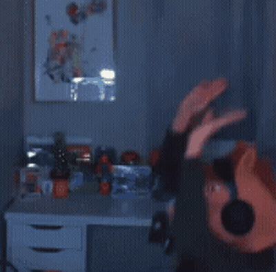 A Blurred Image Of A Person Wearing Headphones And A Pig Head GIF