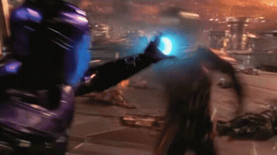 A Blurred Image Of A Person With A Blue Light Coming Out Of Their Chest GIF