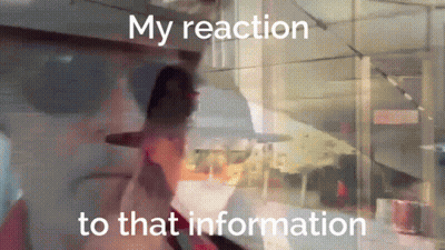 A Blurred Image Of A Person With The Words My Reaction To That Information GIF