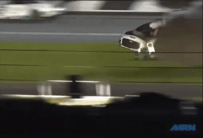 A Blurred Image Of A Race Car With The Words Mrn On The Bottom Right GIF