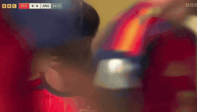 A Blurred Image Of A Red And Orange Background With A Bbc Logo GIF