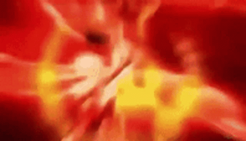 A Blurred Image Of A Red And Yellow Background With A Flame Coming Out Of It . GIF