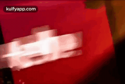 A Blurred Image Of A Red Background With The Words Kulfyapp.com On The Bottom GIF