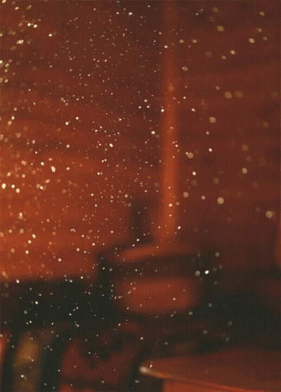 A Blurred Image Of A Room With A Few Lights On The Wall GIF