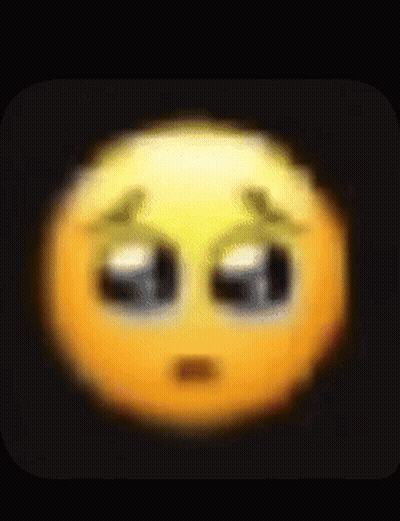 A Blurred Image Of A Sad Smiley Face With Tears Coming Out Of Its Eyes . GIF