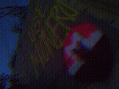 A Blurred Image Of A Sign That Says ' No Parking ' GIF