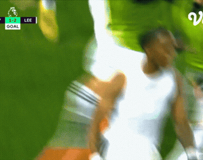 A Blurred Image Of A Soccer Game With The Score 1-2 Lee GIF