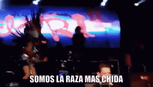 A Blurred Image Of A Stage With The Words Somos La Raza Mas Chida On The Bottom GIF