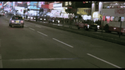 A Blurred Image Of A Street With A Sign That Says ' A ' On It GIF